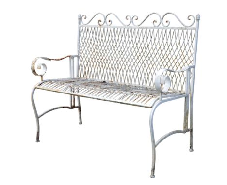 A WROUGHT-IRON WHITE PAINTED GARDEN BENCH 20th century, with scrolling cresting rails over lattice work back and seat, 98cm h