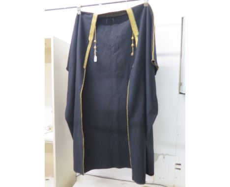 A 1940's/50's Arabic Bisht cloak, black with gold collar and edging and buttons/toggles - approx 160cm x 145cm - good overall