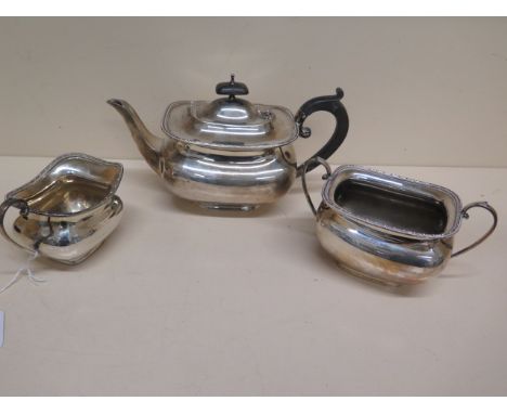 A three piece silver tea set - Teapot approx 26cm x 15cm, sugar bowl and milk jug Sheffield 1927 - total weight approx 32 tro