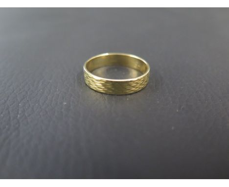 An 18ct yellow gold wedding band - size R - weight approx 3.5 grams 