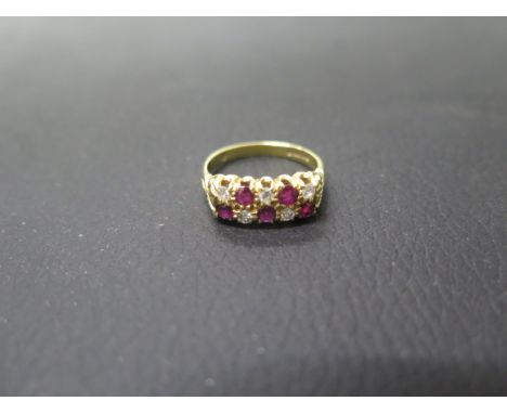 An 18ct yellow gold diamond and ruby double row ring size O - weight approx 5.3 grams 