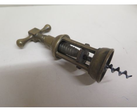 A vintage brass corkscrew 
