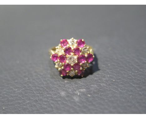 An 18ct yellow gold diamond and ruby cluster ring size J/K - weight approx 5.1 grams 