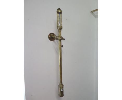 A brass ships barometer - approx 95cm - with fixed brass  wall mount 