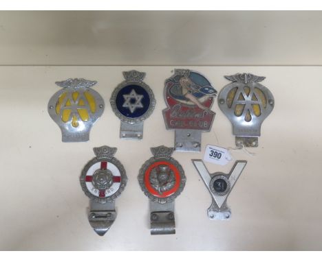 Seven vintage car badges 