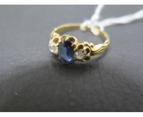 An 18ct yellow gold three stone ring with sapphire and diamonds - ring size K - weight approx 2.7 grams 