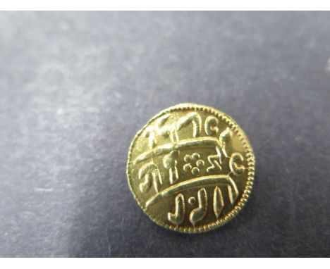 A Middle Eastern gold coin tested as 22ct with Arabic script, reverse with added metal mount for use as a button/brooch etc -