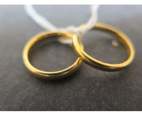 Two 22ct yellow gold wedding bands sizes N &amp; K/L - combined weight approx 7.2 grams 