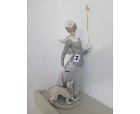 A Lladro lady and her dog - Height 38cm - good condition apart from a broken umbrella 
