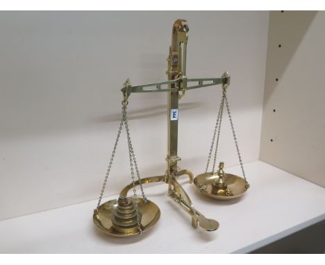 A set of brass scales and weights 