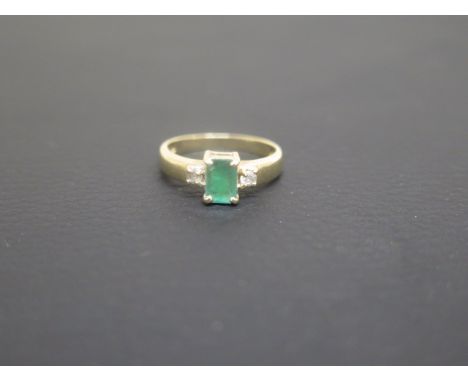 A 9ct yellow gold and emerald ring size K - weight approx 2.6 grams