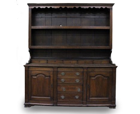 A LATE 18TH / EARLY 19TH CENTURY OAK FARMHOUSE DRESSER  with shaped cornice and pediment top with two open shelves above five