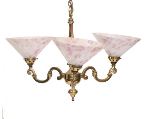 A BRASS HANGING CEILING LIGHT with three scrolling branches, each with conical pink and white glass shades, approximately 50c
