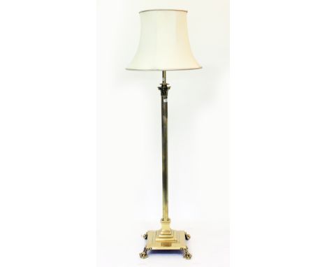 A GEORGIAN STYLE BRASS LAMP STANDARD of Corinthian column form, standing on a square spreading base standing on ball and claw