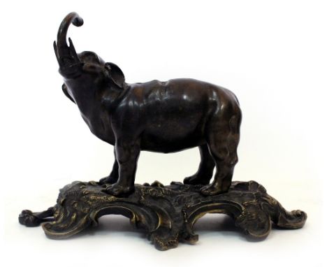 A LATE 19TH / EARLY 20TH CENTURY BRONZE CLOCK STAND in the form of an elephant, 32cm wide x 24cm high