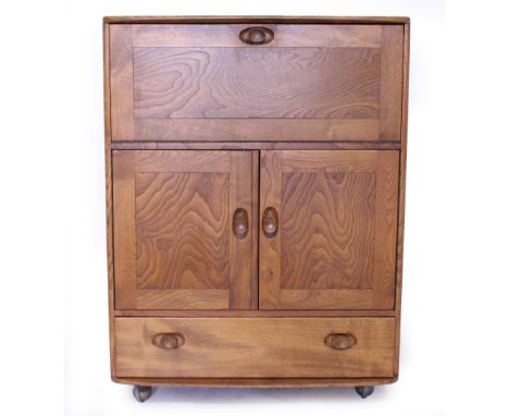 A 20TH CENTURY LIGHT ELM ERCOL BUREAU model number 469, 81cm x 110cm x 41cm