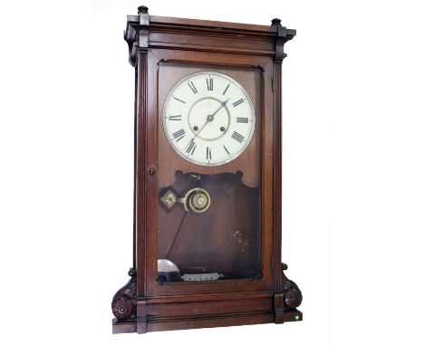 A 20TH CENTURY MAHOGANY CASED VIENNA STYLE WALL CLOCK with tin plates, dial and Roman numerals, with carved cased 70cm 