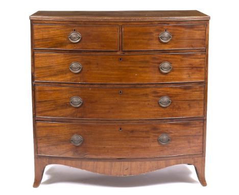 A GEORGE III MAHOGANY BOW FRONTED CHEST OF TWO SHORT AND THREE LONG DRAWERS with oval brass handles and outswept bracket feet