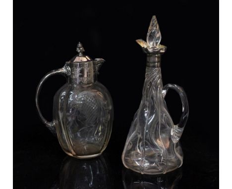 A SILVER MOUNTED CLARET JUG of wrythen form with marks for London dated 1924 by Army and Navy Corporate Society Limited, 31cm