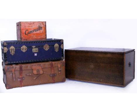 AN OLD OAK TRUNK  100cm wide x 53cm deep x 52cm high together with an old leather travelling trunk, a blue travelling trunk a