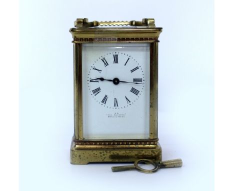 A LATE 19TH / EARLY 20TH CENTURY FRENCH BRASS CARRIAGE CLOCK with white enamel dial marked 'The Equator', with key