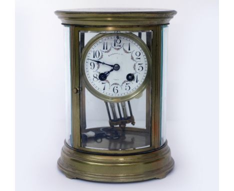 AN EARLY 20TH CENTURY FRENCH OVAL FOUR GLASS MANTLE CLOCK the dial signed 'Elkington & Co Paris', the movement striking the h
