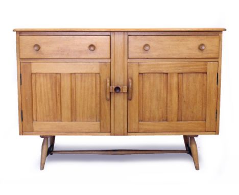A 20TH CENTURY ERCOL STYLE LIGHT ELM SIDEBOARD  with two fitted drawers and cupboards, standing on turned legs united by a H 