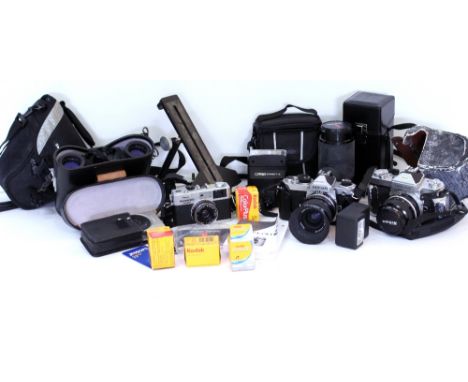 A QUANTITY OF CAMERAS to include a Nikon FM2125954 with a zoom - Nikkor 35-70mm lens, a Nikkormat camera with a Nikkor 35mm l