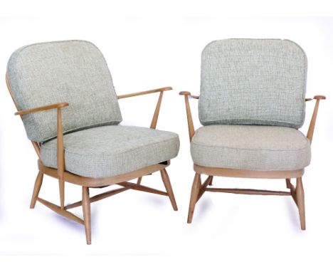A PAIR OF 20TH CENTURY LIGHT ELM ERCOL ARMCHAIRS model number 334, with seven spindled back (cushions for decorative purposes