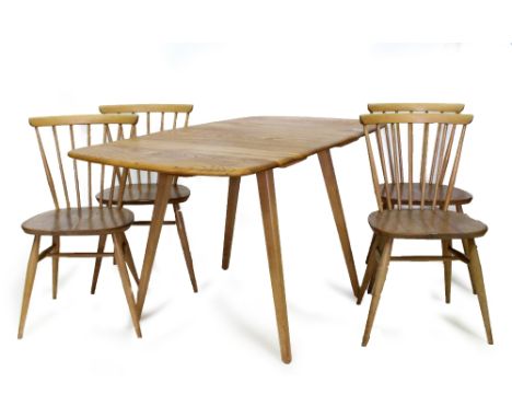 A 20TH CENTURY LIGHT ELM ERCOL DROP LEAF DINING TABLE  and four chairs with seven spindle back, the table model number is 492