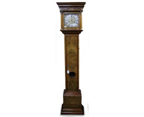 AN 18TH CENTURY STYLE WALNUT EIGHT DAY LONG CASE CLOCK of small size, the brass dial with angel spandrels, the movement strik