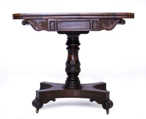 A WILLIAM IV ROSEWOOD CARD TABLE in the manor of Gillows, with a green baize top and beaded and carved decoration 91cm wide x