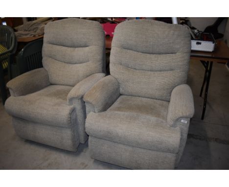 Two modern manual recliner armchairs, in cream