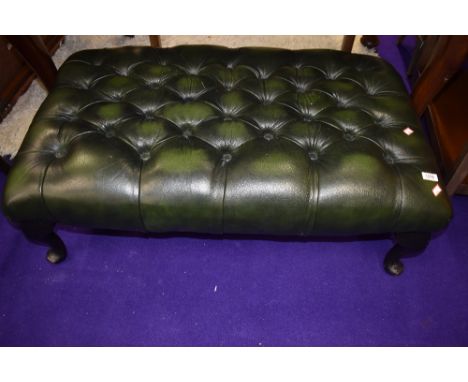 A large Green buttoned leather footstool approx. 95 x 57cm
All joints in good order and solid, a couple of light scratches to