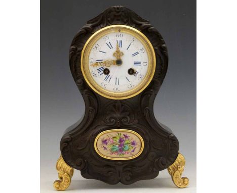 French ebonised rococo style mantel clock, mid 19th century, the moulded composition front set with a floral porcelain panel 