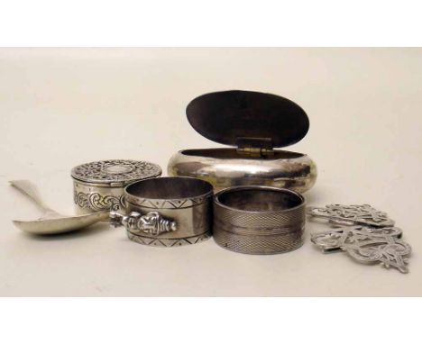 Collection of silver items including snuff box, belt buckle, spoon, pill box, and two napkin rings. Condition report: see ter