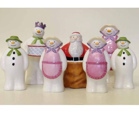 Two pairs of Coalport boxed Snowman salt and pepper cruets, also a sugar shaker and two candle stick figures. Condition repor