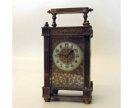 Gilt brass carraige clock with a cut card dial and enamel chapter ring. Condition report: see terms and conditions.