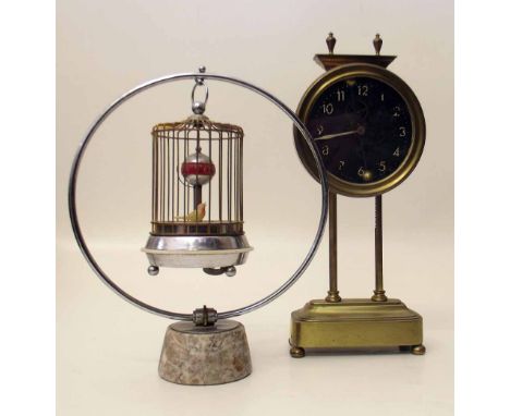 Novelty bird case clock and a brass rise and fall mantel clock circa 1910 (2). Condition report: see terms and conditions.