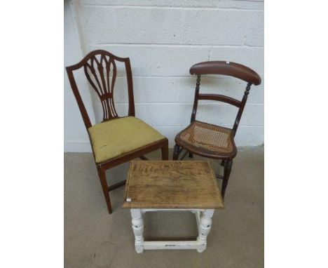 An oak stool with painted base and two chairs.