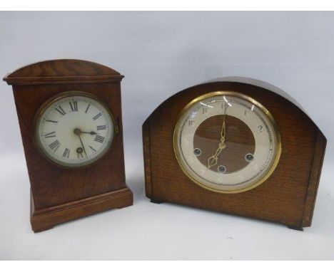 An oak cased mantle clock with a Smiths movement and one other mantle clock stamped W.H.R.
