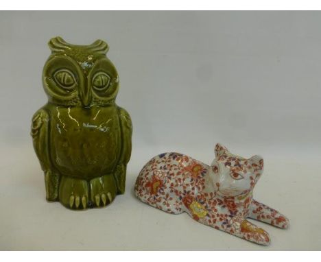 A Chinese recumbent cat and a ceramic owl money box.