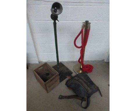 A barrier rope and stand, a converted standard lamp, a horse harness and a Buckley Llanelli advertising crate.