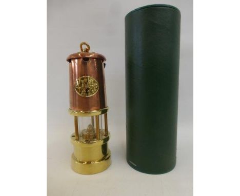 A hand crafted Welsh miner's lamp with instructions.