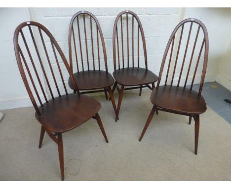 A set of four Ercol highbacked hooped dining chairs.