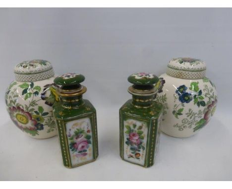 A pair of Mason's lidded ginger jars and a pair of ceramic tea canisters.