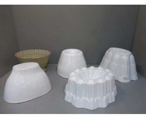 Five assorted ceramic jelly moulds including Shelley.