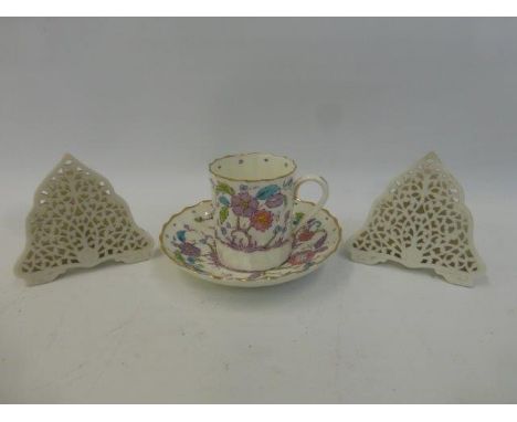 A Royal Worcester Kashmir pattern cabinet cup and saucer, and a pair of G. Grainger & Co. Worcester name card holders with pi
