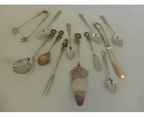 An assortment of flatware including five silver teaspoons, maker M & S Ltd, Sheffield, 1918.