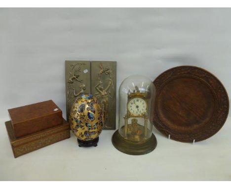 An assortment of mixed collectables including lidded boxes, a brass clock, a decorative enamelled egg on a stand etc.